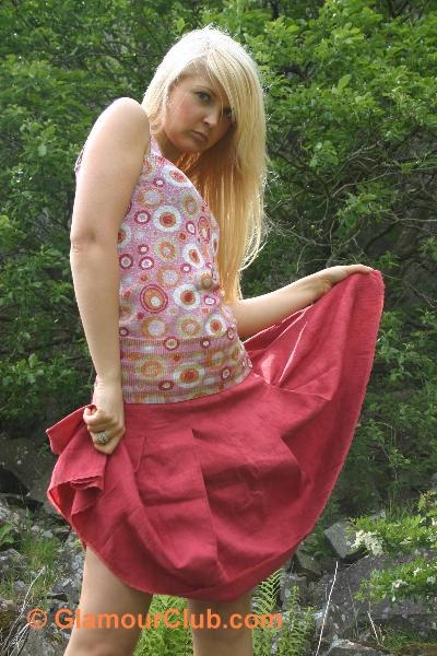 Oksana G lifting up skirt to show knees